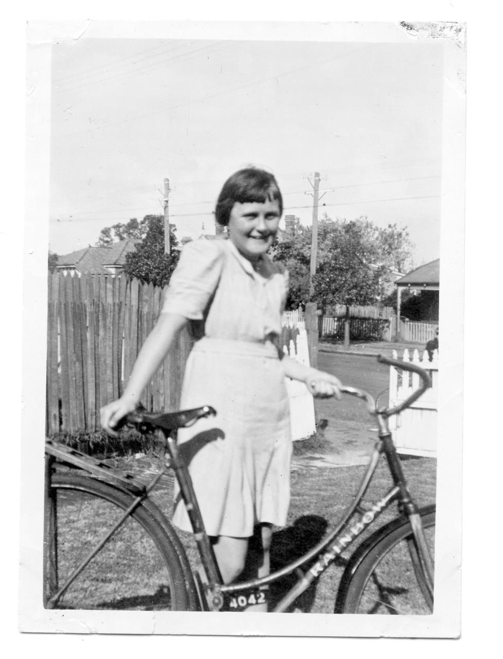 Paula McAdam with bike outside 98 Angove Street, North Perth 1945